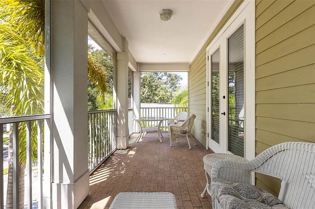 Covered upstairs balcony with seating